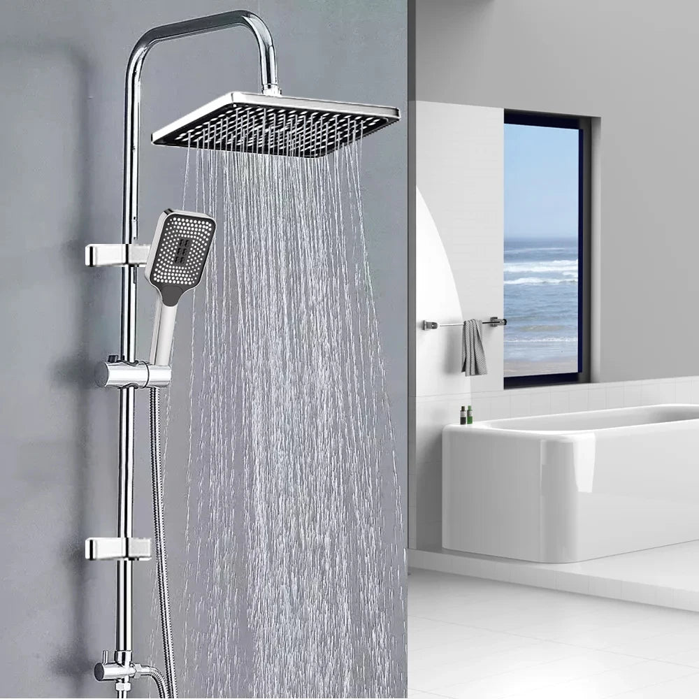 Fenwick shower column in polished silver — square rainfall head on gooseneck arm, handheld on sliding rail, mixer at the base